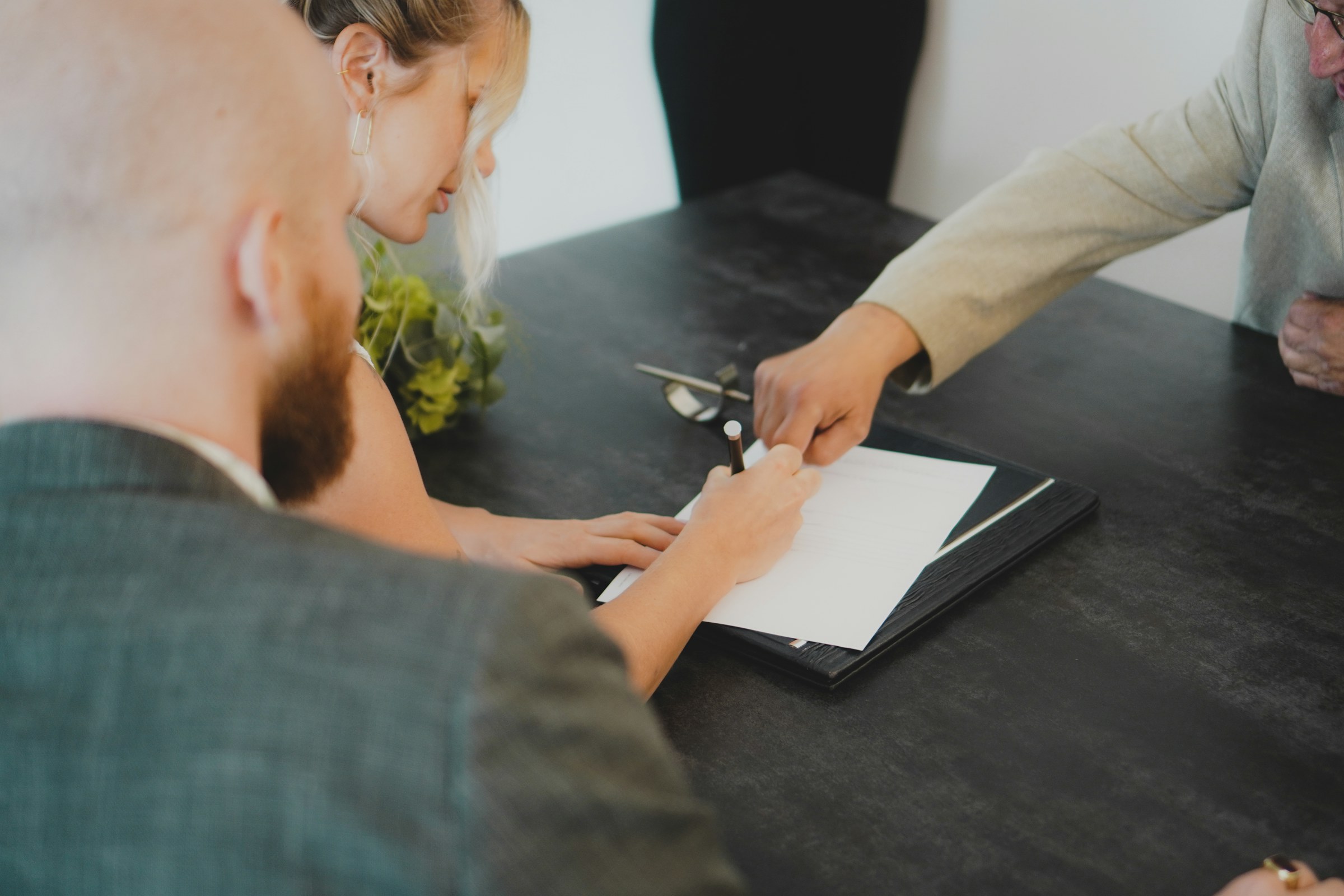 Homebuyers reviewing financial documents during a mortgage consultation